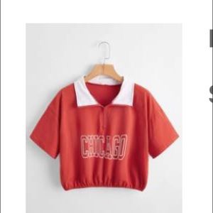A red chicago Cropped t shirt with a white color.